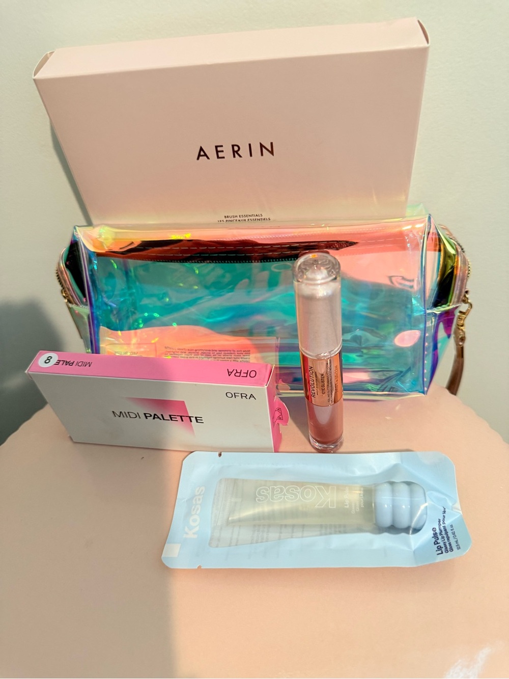 Aerin make up brush set, kosas, ofra, revolution dual side eye shadow, bag